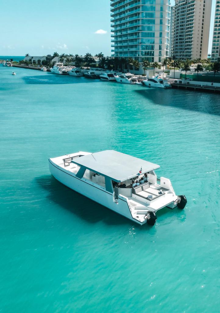 CATAMARAN LUXURY SPORT 55 FT_MR. C. CATAMARAN_CANCUN_BOAT HIGH ANGLE SIDEVIEW